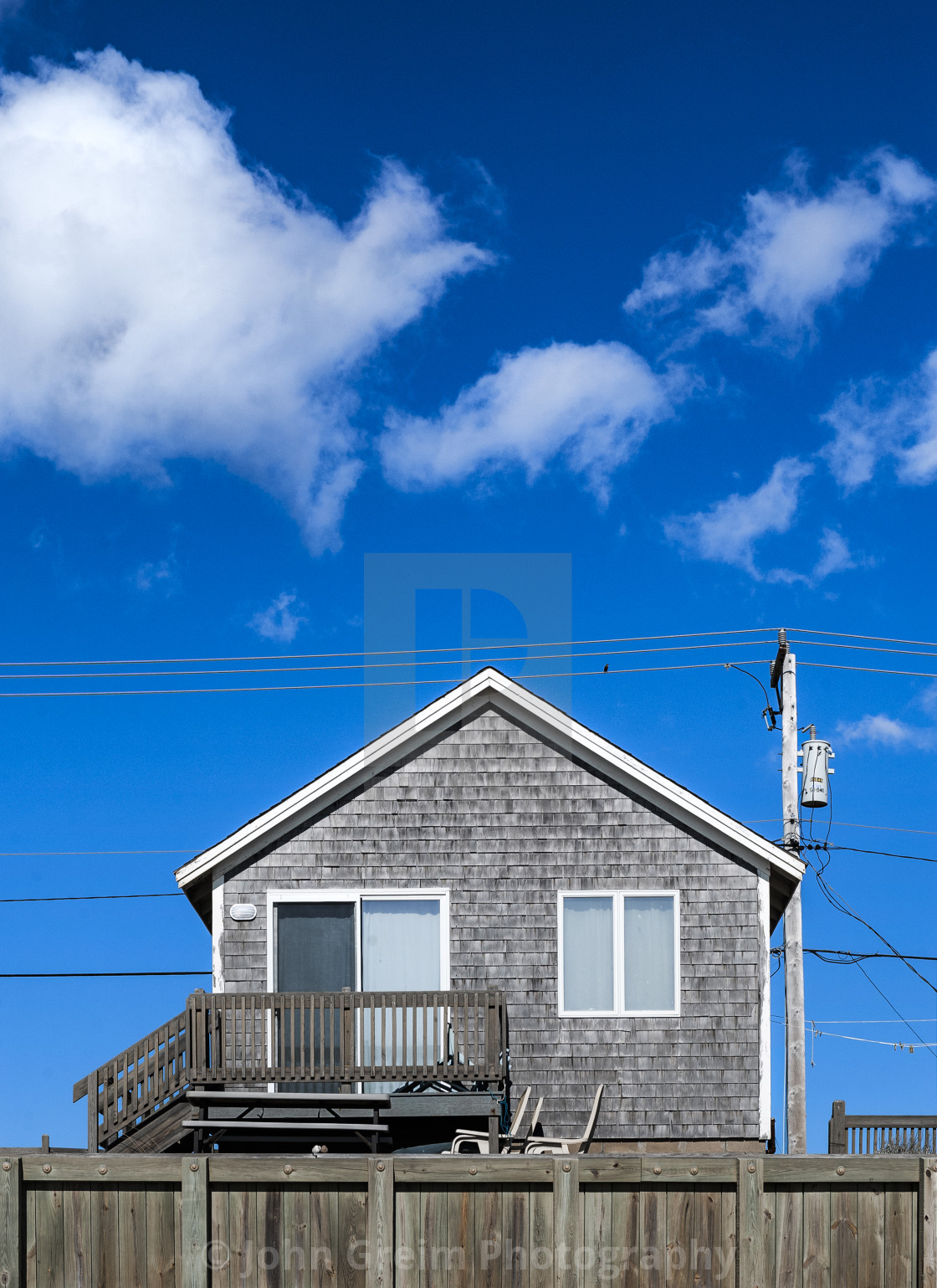 "Small coastal beach cottage" stock image