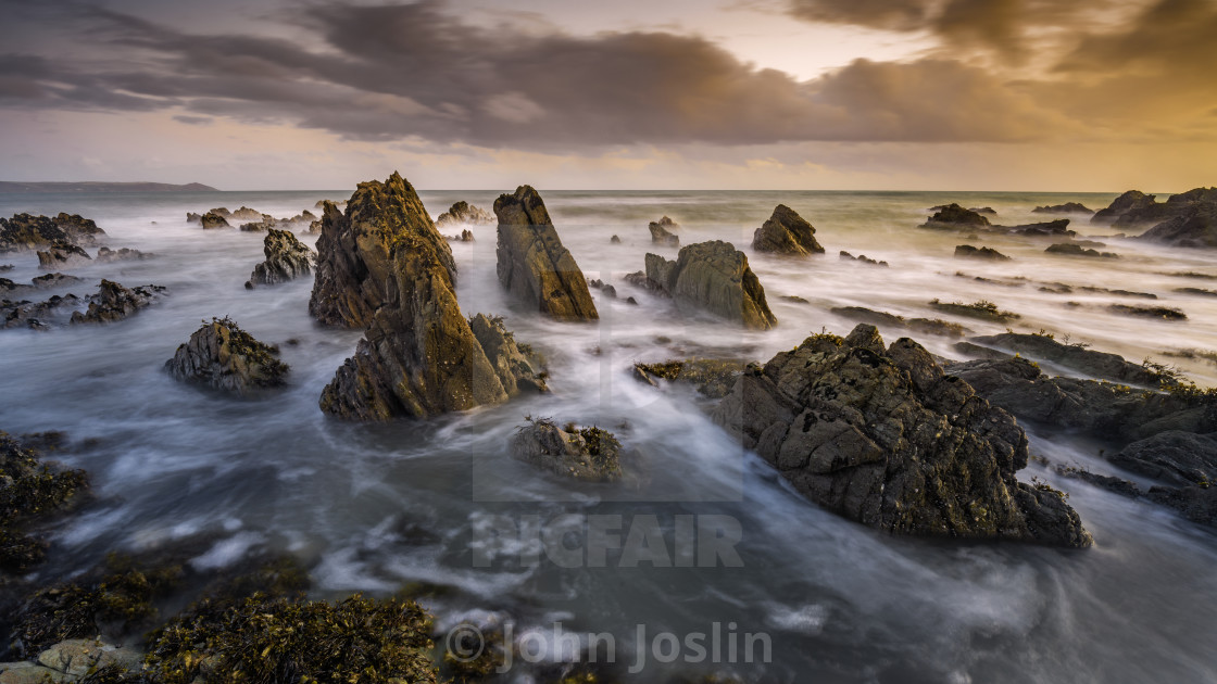 "Rocks & Sea swirls.jpg" by John Joslin - $38.84 "Rocks & Sea swirls.jpg" stock image