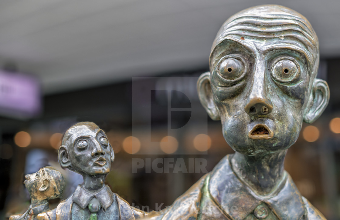 "Three Bronze Men" stock image