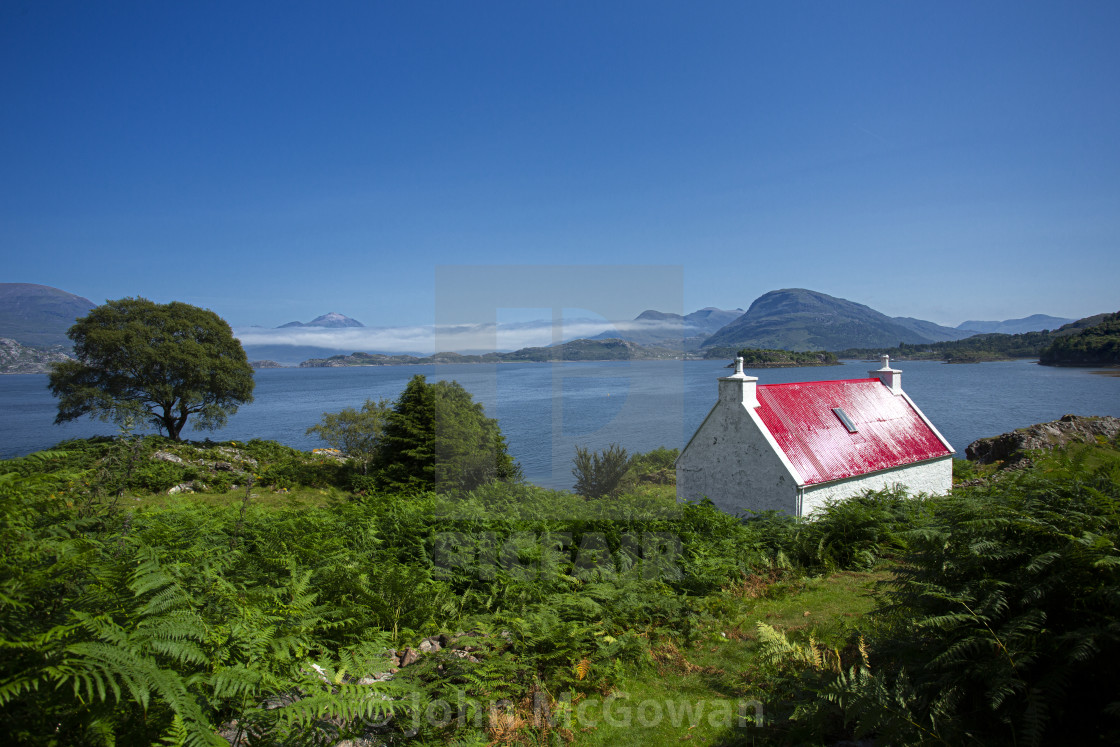 "The Wee Red Cottage on Loch Shieldaig, Scottish highlands" stock image