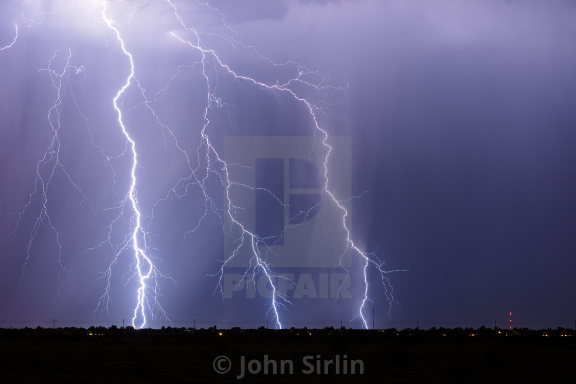 "Lightning bolts strike from a thunderstorm" by John Sirlin - $29.56 "Lightning bolts strike from a thunderstorm" stock image