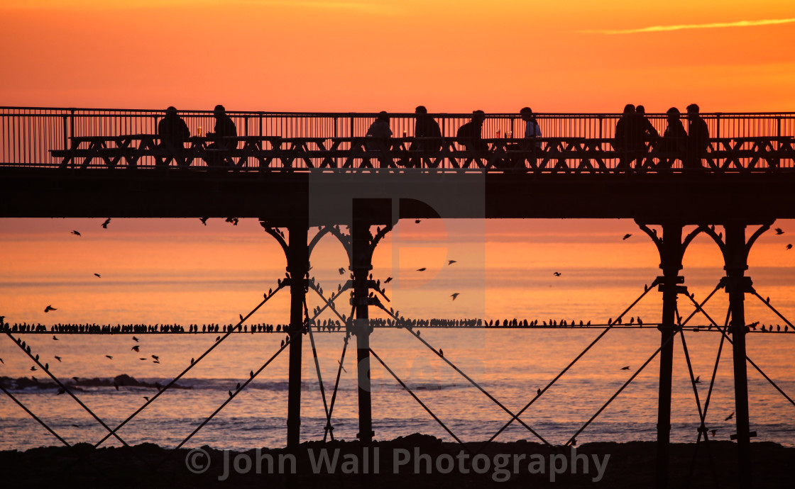 "Enjoying a drink at Sunset" by John Wall Photography - $15.26 "Enjoying a drink at Sunset" stock image