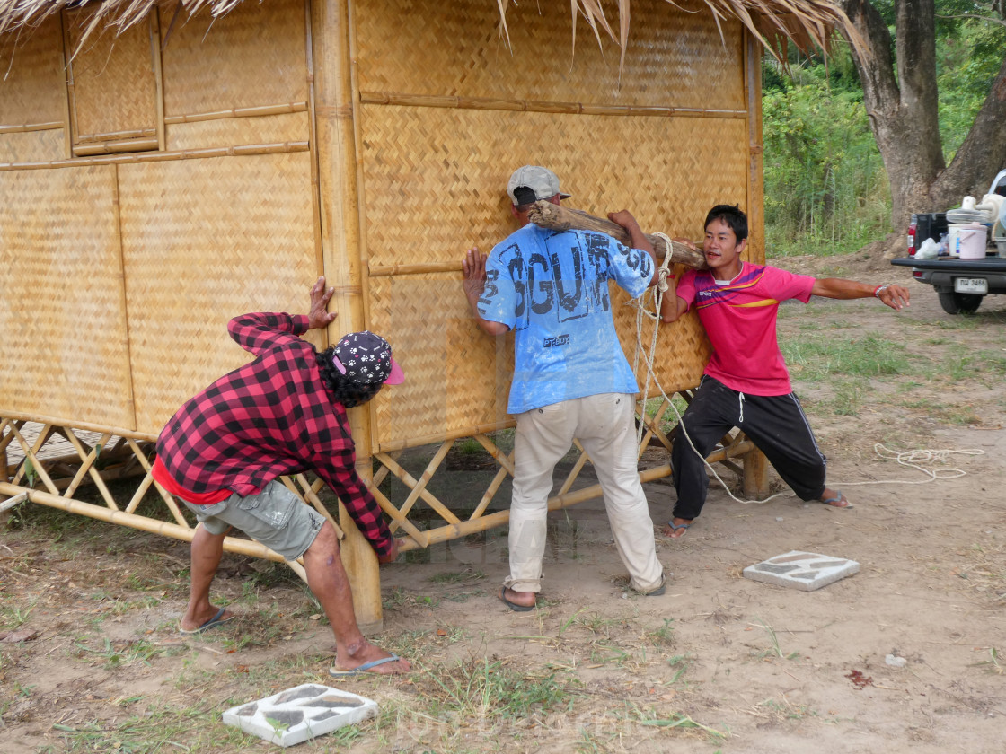 "Moving a new hut the hard way. Thailand" stock image