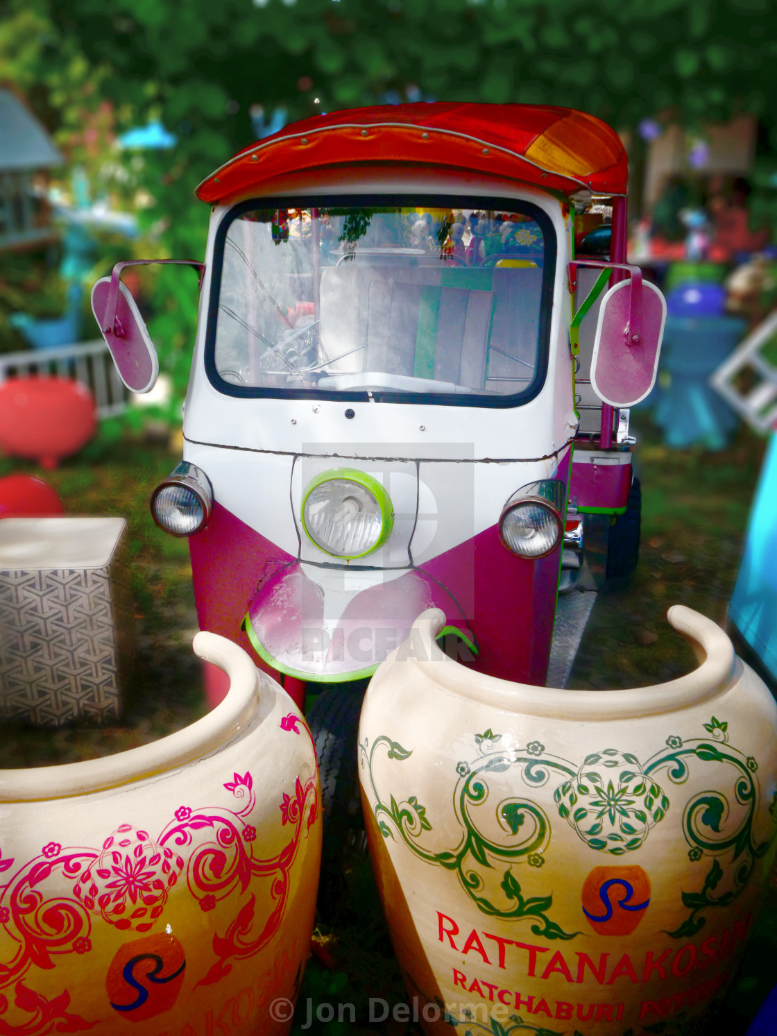 "Giant garden pots and a classic Tuc Tuc" stock image