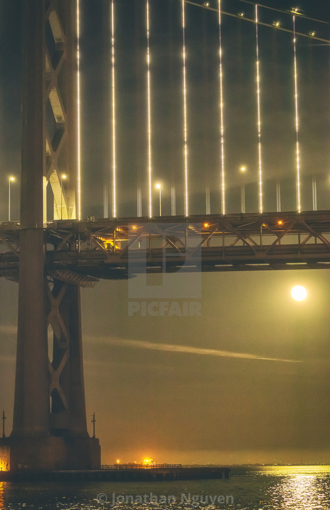 "moonrise under bridge" stock image