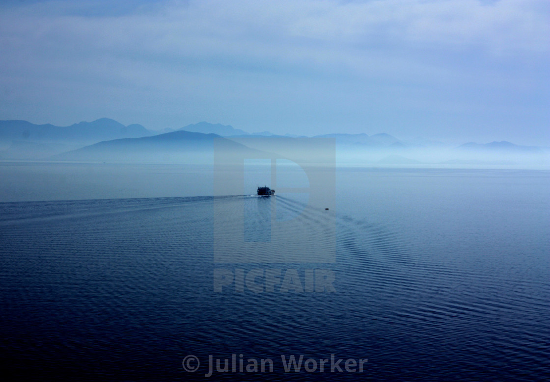 "Small ferry heading southwards away from Corfu" by Julian Worker - $7.65 "Small ferry heading southwards away from Corfu" stock image