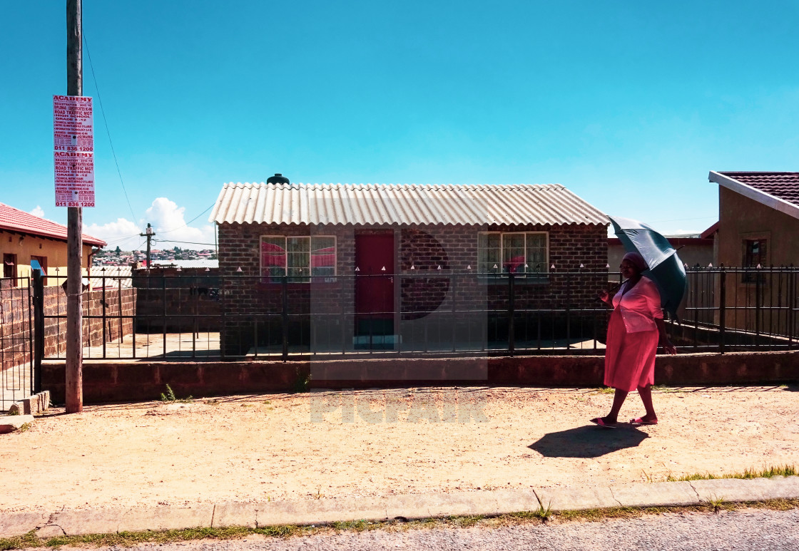 "'The Lady In Red' - Soweto Life" stock image