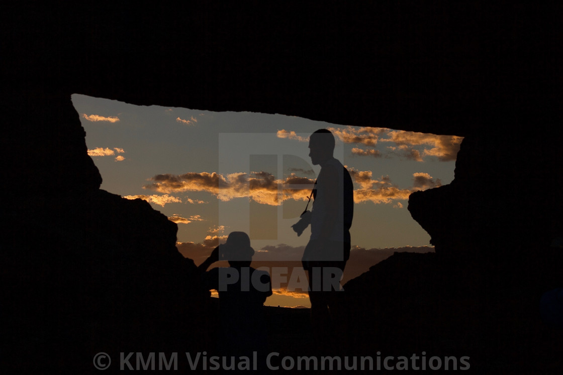 "Tourists in rock window, Isalo National Park, Madagascar" by KMM Visual Communications - $15.22 "Tourists in rock window, Isalo National Park, Madagascar" stock image