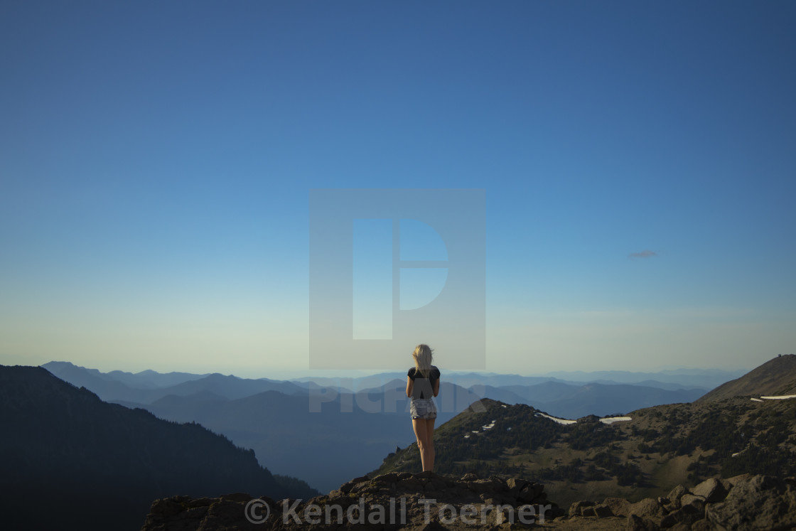 "Mount Rainier Girl Looking At Distant Mountains" by Kendall Toerner - $18.40 "Mount Rainier Girl Looking At Distant Mountains" stock image