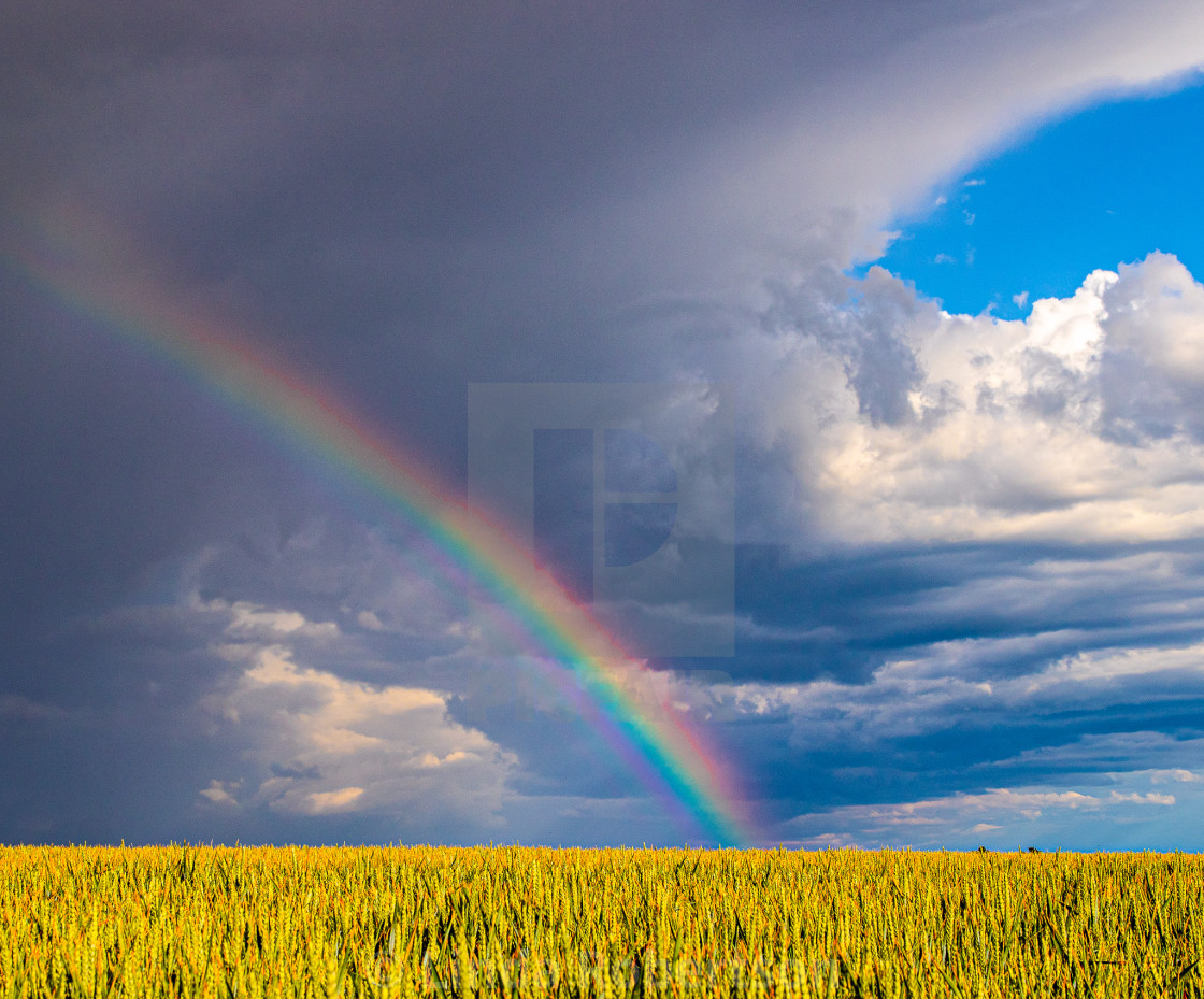 "Rainbow and storm clouds" stock image