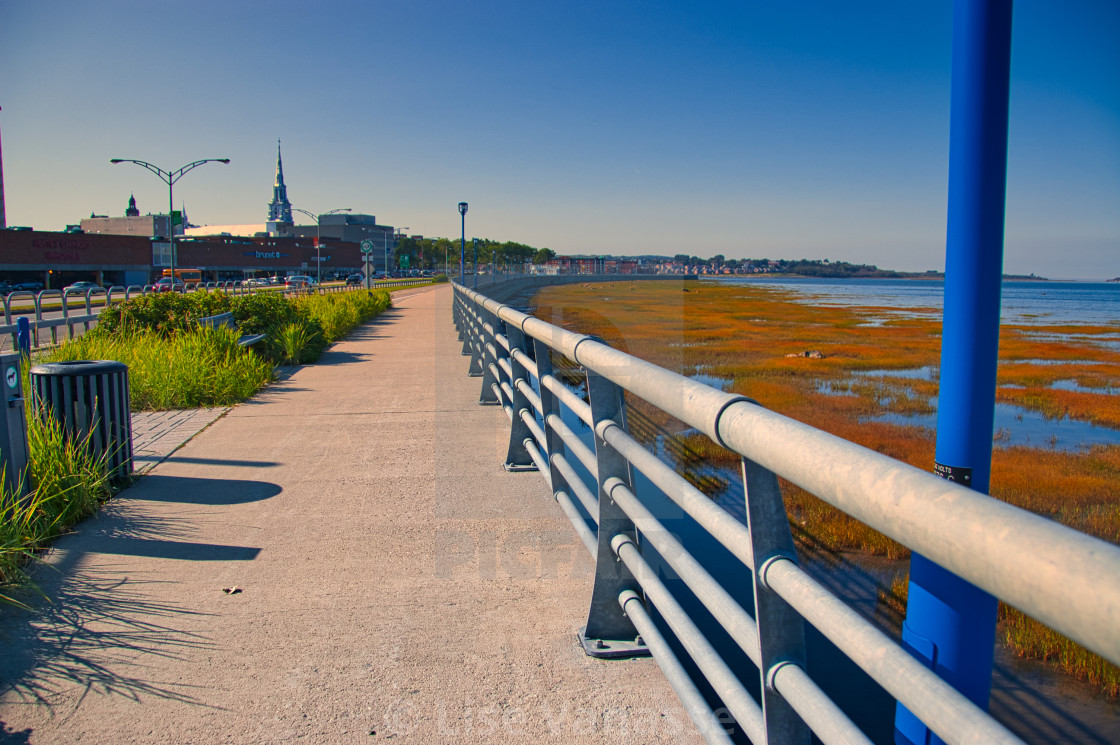 "The pedestrian sidewalk that runs along the St. Lawrence River." by Lise Vanasse - £1.00 "The pedestrian sidewalk that runs along the St. Lawrence River." stock image