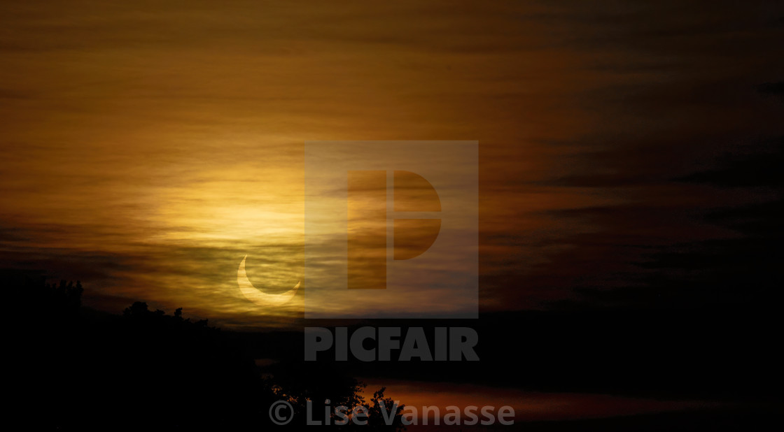 "A solar eclipse of June 2021." by Lise Vanasse - $1.52 "A solar eclipse of June 2021." stock image