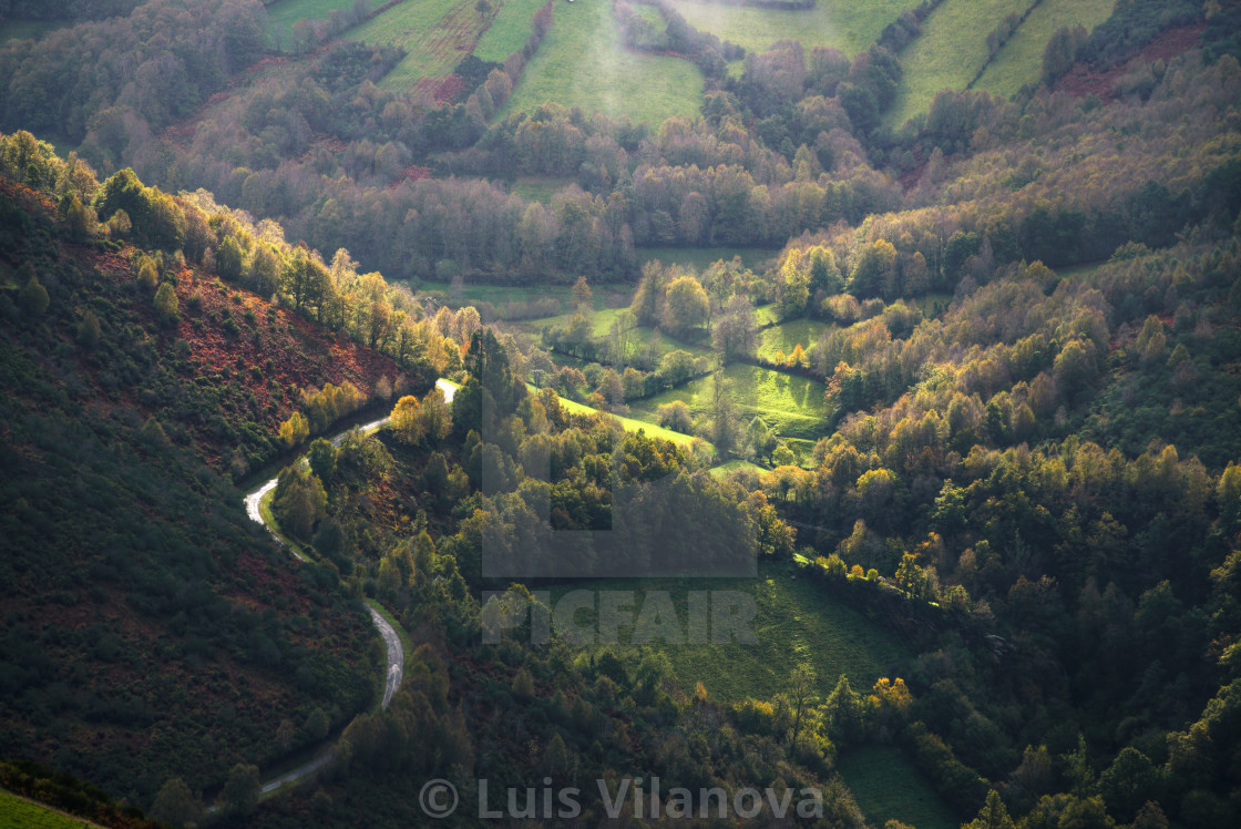 "A rural road leads to a beautiful luminous valley" by Luis Vilanova - $15.31 "A rural road leads to a beautiful luminous valley" stock image