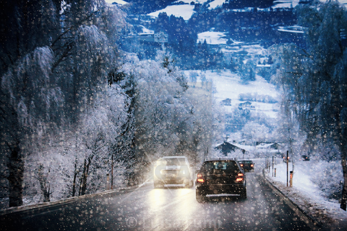 "Car traffic on a mountain route during a snow storm on the Austrian Alps" stock image