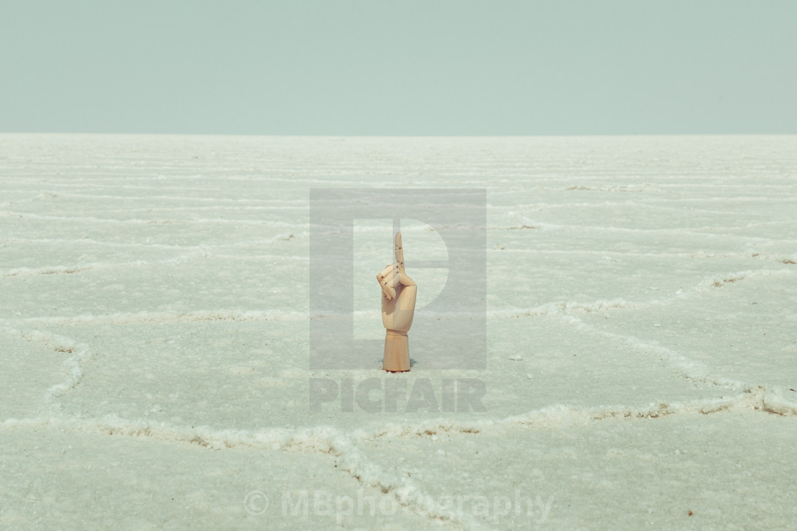 "Wooden model hand in the Salt Flats of Utah, pointing up. Copy s" stock image