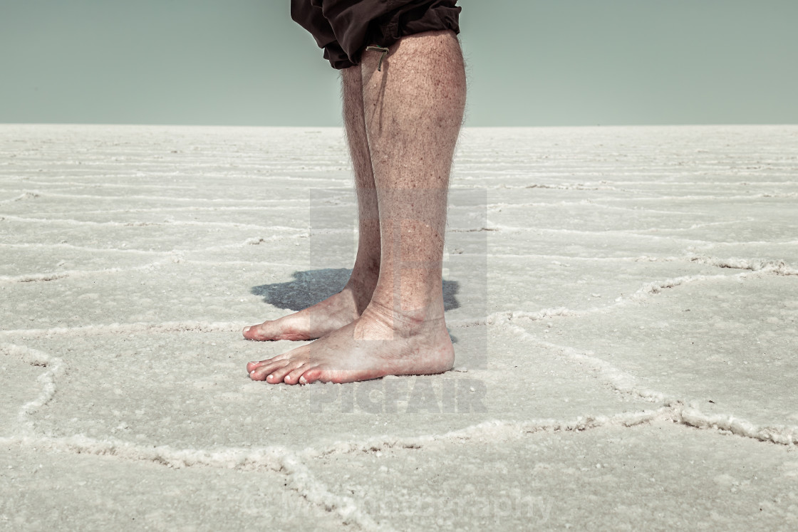 "Man standing bare foot in the Salt Flats of Utah" stock image