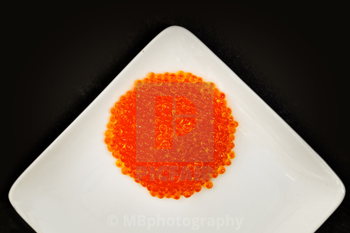 "Salmon caviar on a white plate" stock image