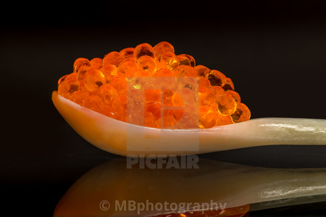 "Fresh salmon caviar on a mother of pearl spoon" stock image