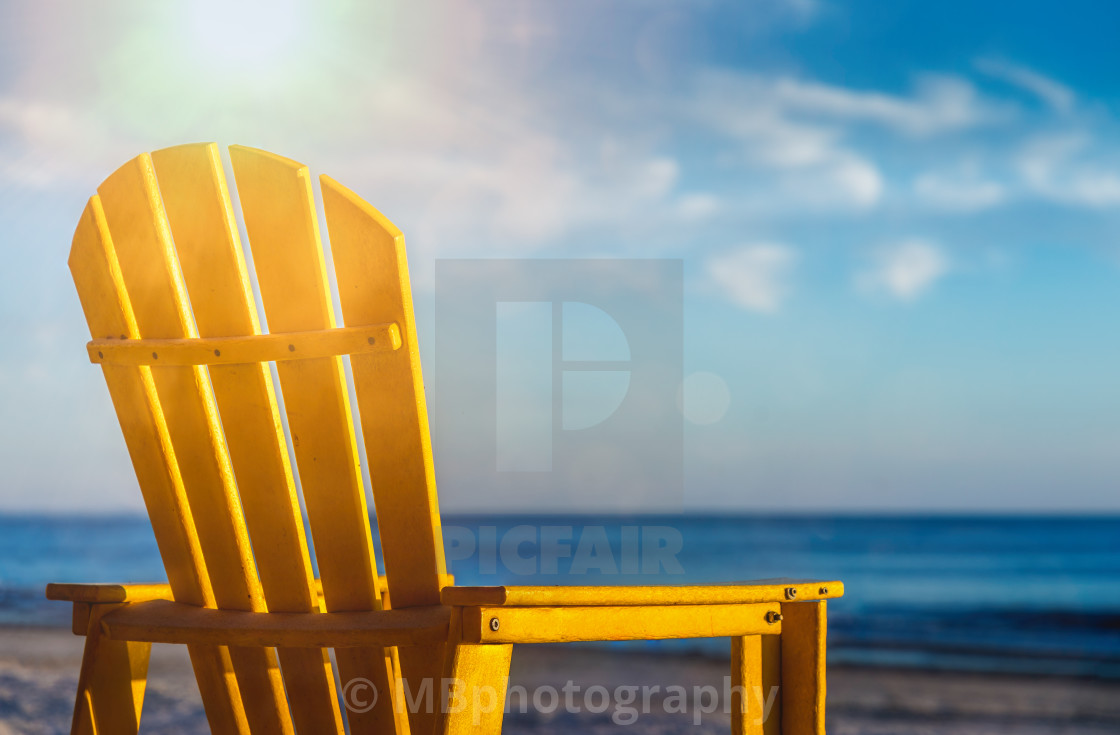 "A yellow chair on the sand beach in Florida" stock image