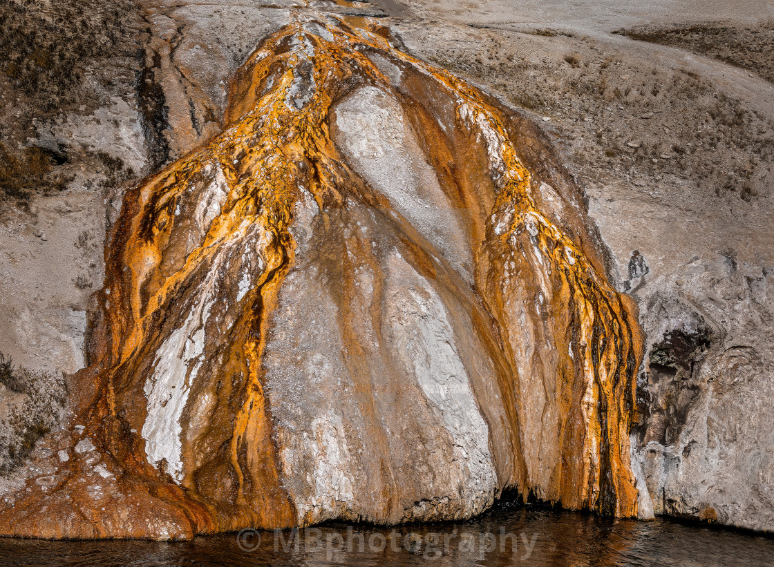 "Golden geothermal structures of the geyser sediments in the Yellowstone National Park" stock image