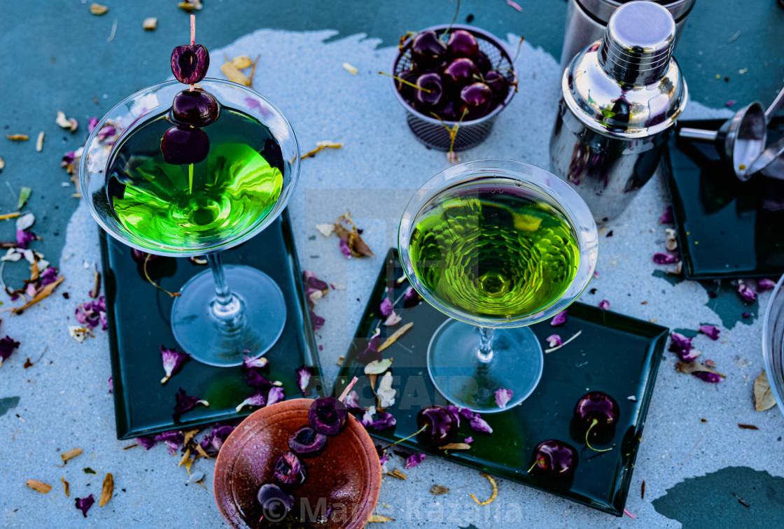 "two stemware drink glasses containing green cocktails" by Marie Kazalia - $15.16 "two stemware drink glasses containing green cocktails" stock image