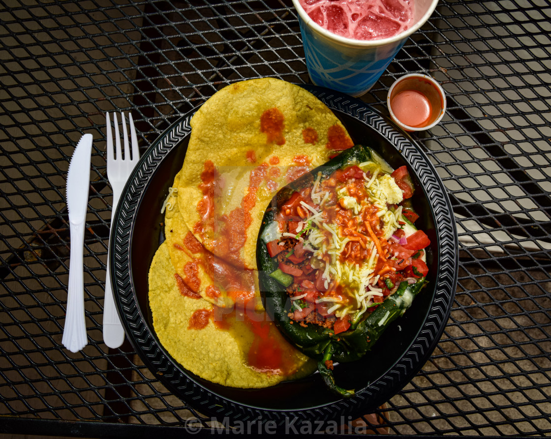 "stuffed pepper lunch on patio of Mexican American restaurant" by Marie Kazalia - $15.16 "stuffed pepper lunch on patio of Mexican American restaurant" stock image