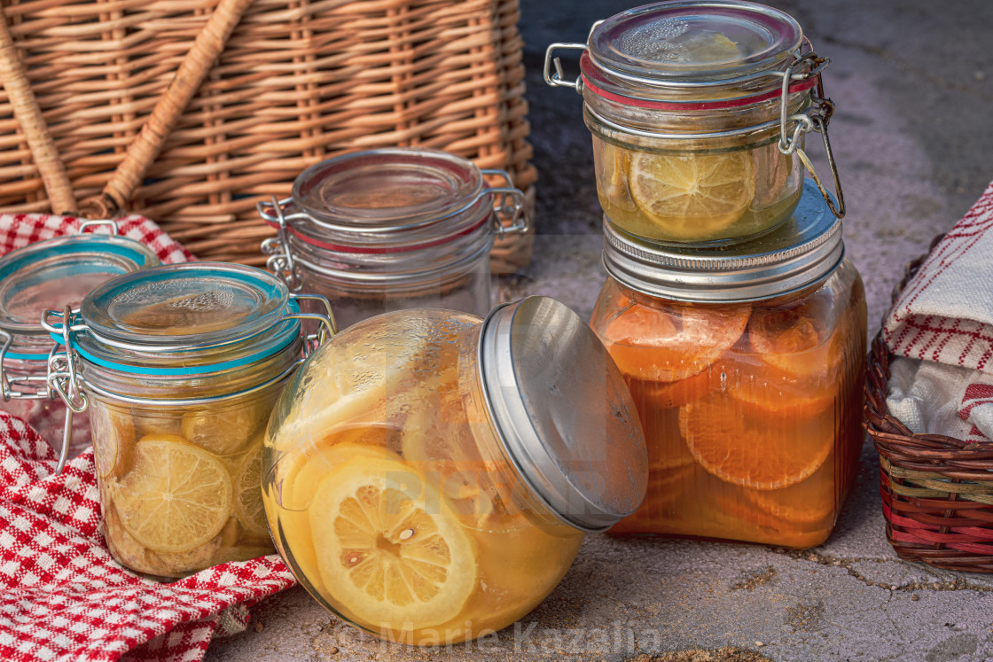 "glass jars of fermented citrus slices for cooking and baking" by Marie Kazalia - $15.16 "glass jars of fermented citrus slices for cooking and baking" stock image
