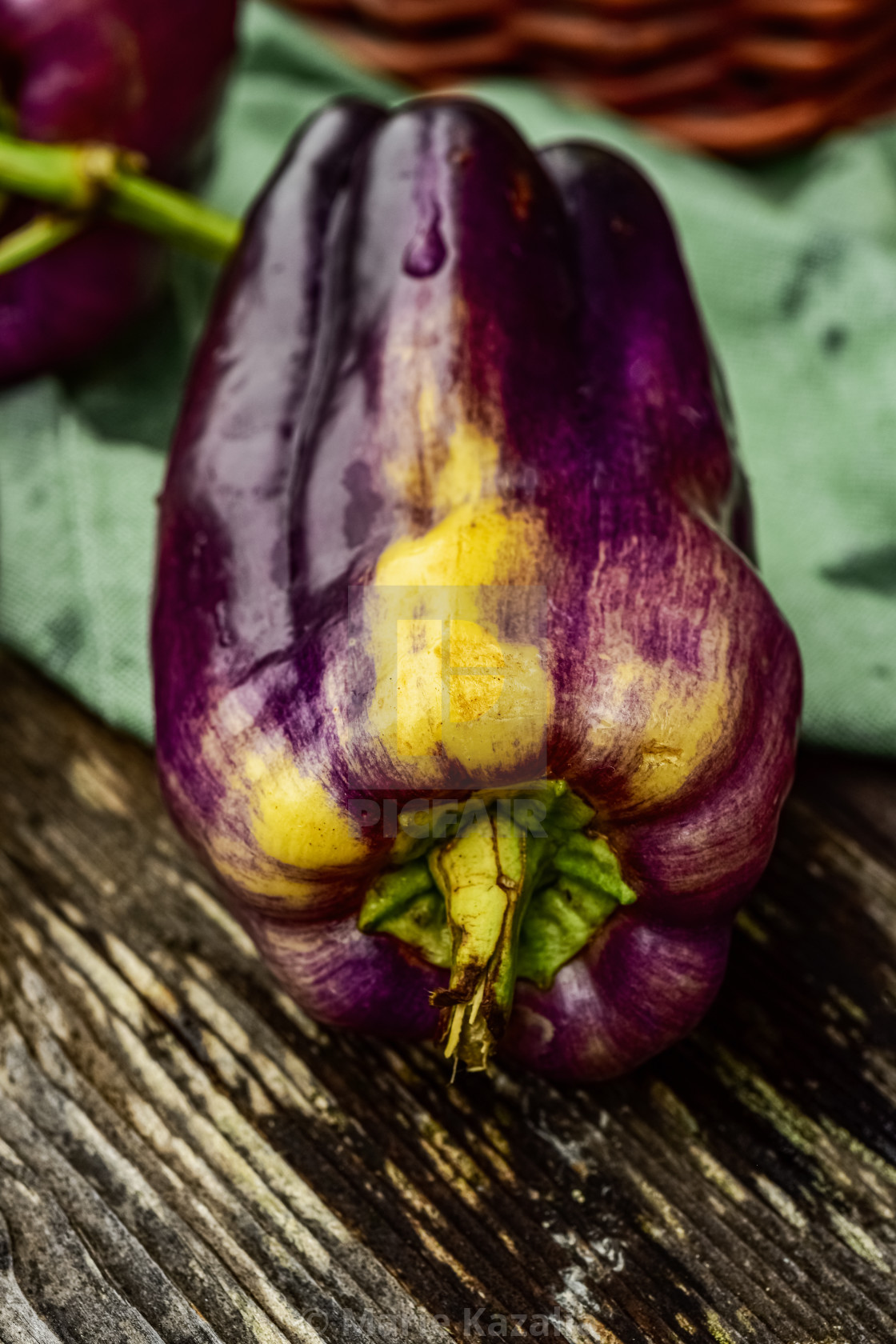 "fresh purple bell pepper on rustic wood tabletop" by Marie Kazalia - $15.16 "fresh purple bell pepper on rustic wood tabletop" stock image