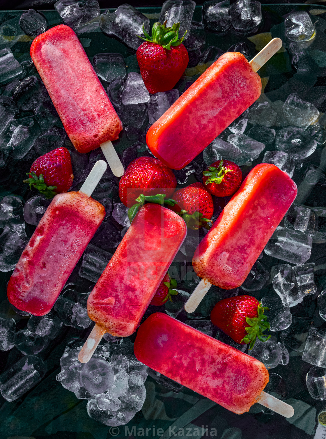 "frozen strawberry pops on sticks summer dessert" by Marie Kazalia - $15.16 "frozen strawberry pops on sticks summer dessert" stock image