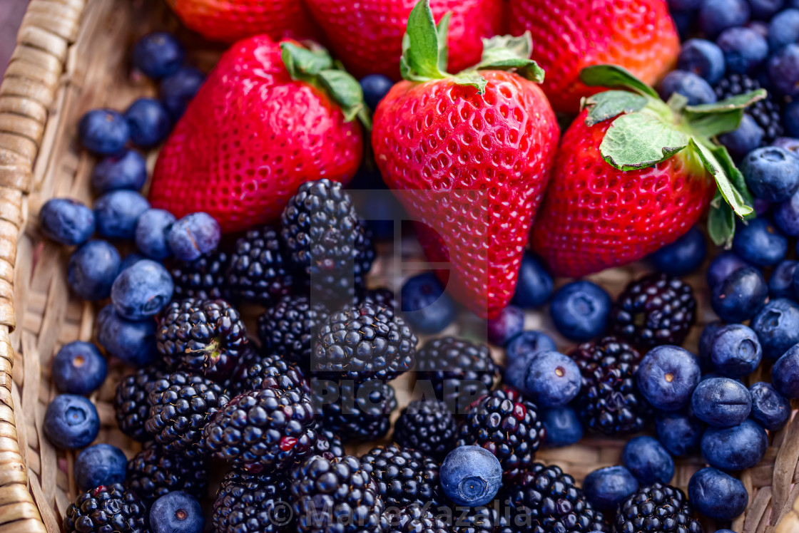 "basket of whole ripe strawberries, blueberries and blackberries" by Marie Kazalia - $15.16 "basket of whole ripe strawberries, blueberries and blackberries" stock image