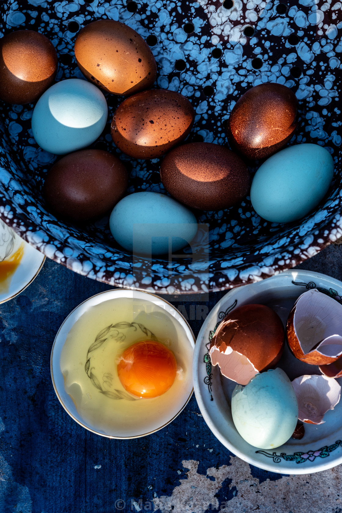 "cooking brown and blue farm eggs early morning" by Marie Kazalia - $15.44 "cooking brown and blue farm eggs early morning" stock image