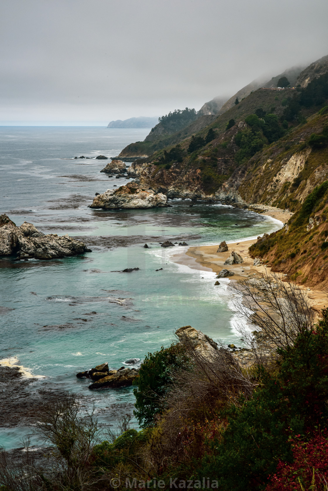 "overcast cloudy sky on Pacific Ocean coast of California rocky shoreline" stock image