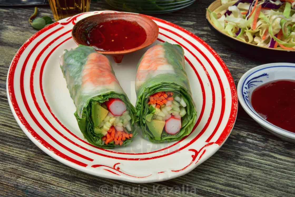 "tabletop still life with fresh green Summer rolls on platter" stock image