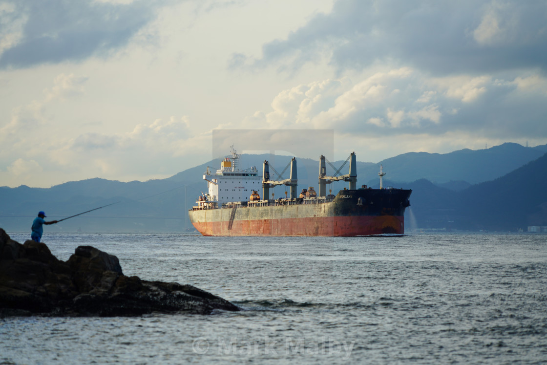 "The Fisherman and the Freighter" by Mark Malby - $21.81 "The Fisherman and the Freighter" stock image