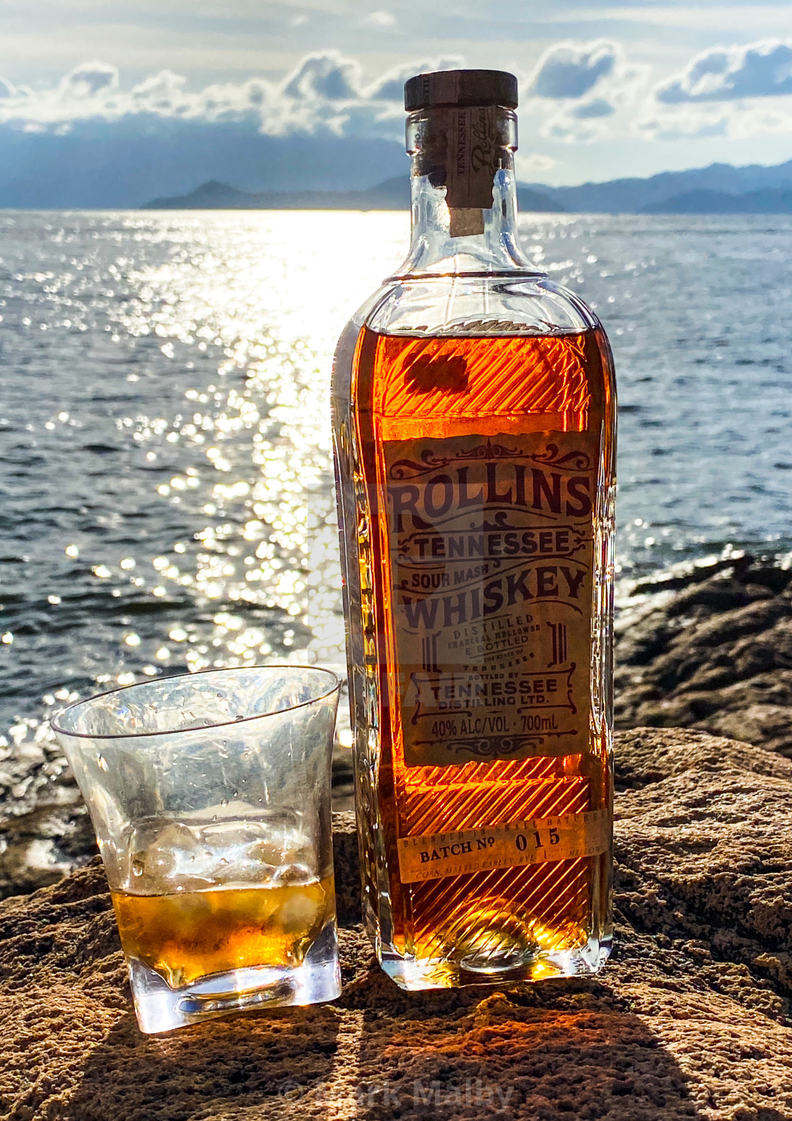 "Rollins Whiskey against a summer sea" by Mark Malby - $31.16 "Rollins Whiskey against a summer sea" stock image