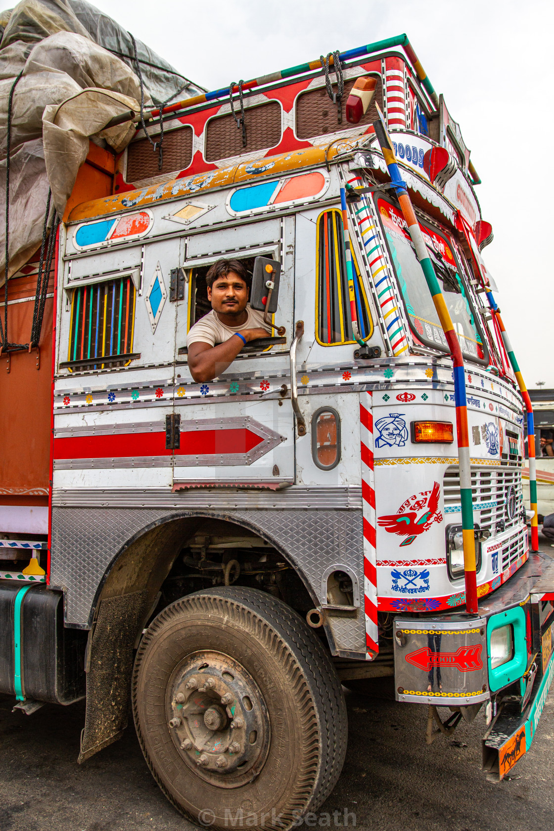 a decorated indian truck and its driver license download or print for 12 00 photos picfair https www picfair com pics 010423944 a decorated indian truck and its driver
