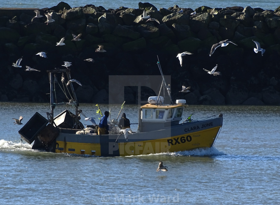 "Hastings fishing boat returning home." stock image