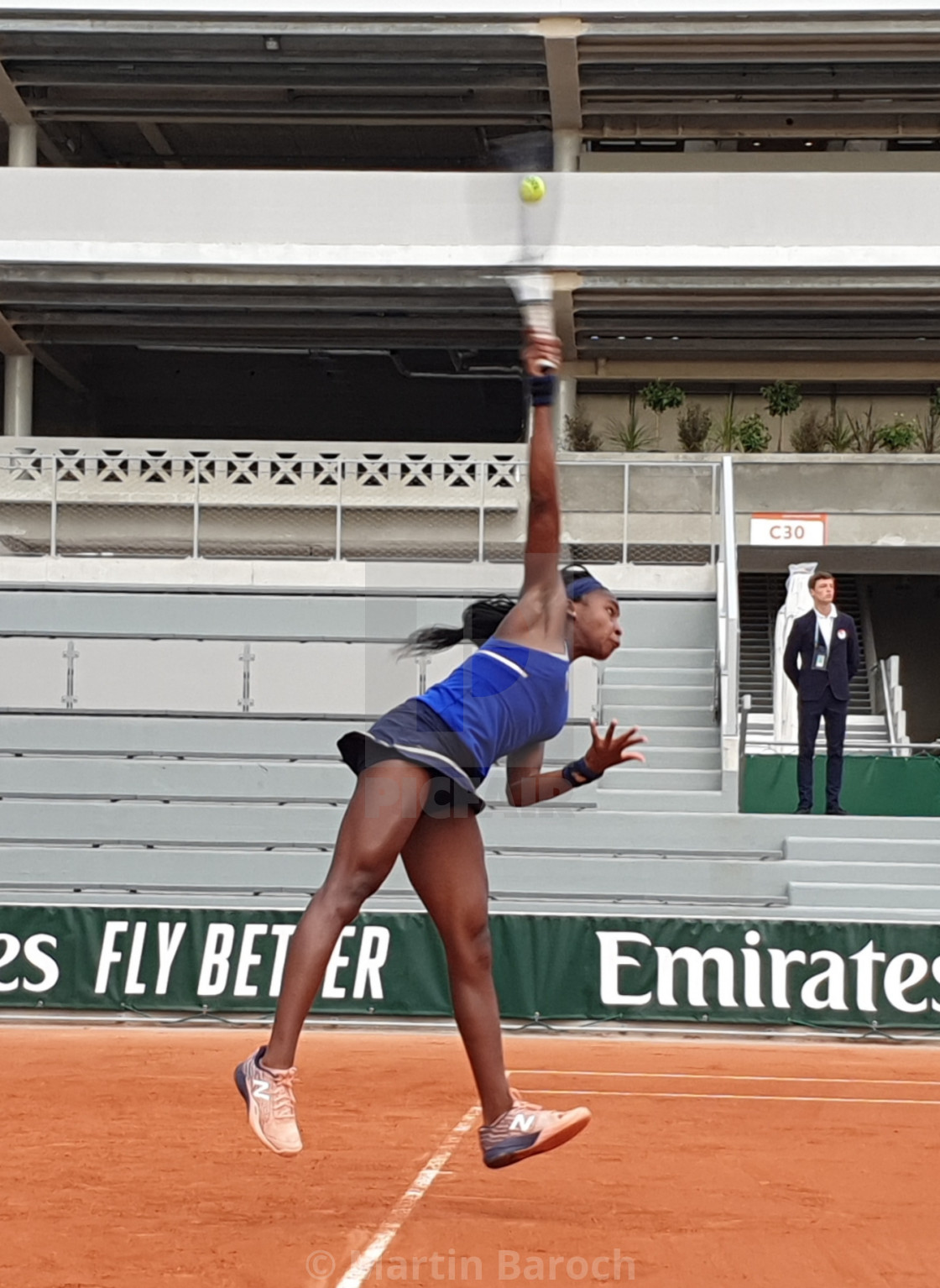 "Coco Gauff serving" stock image