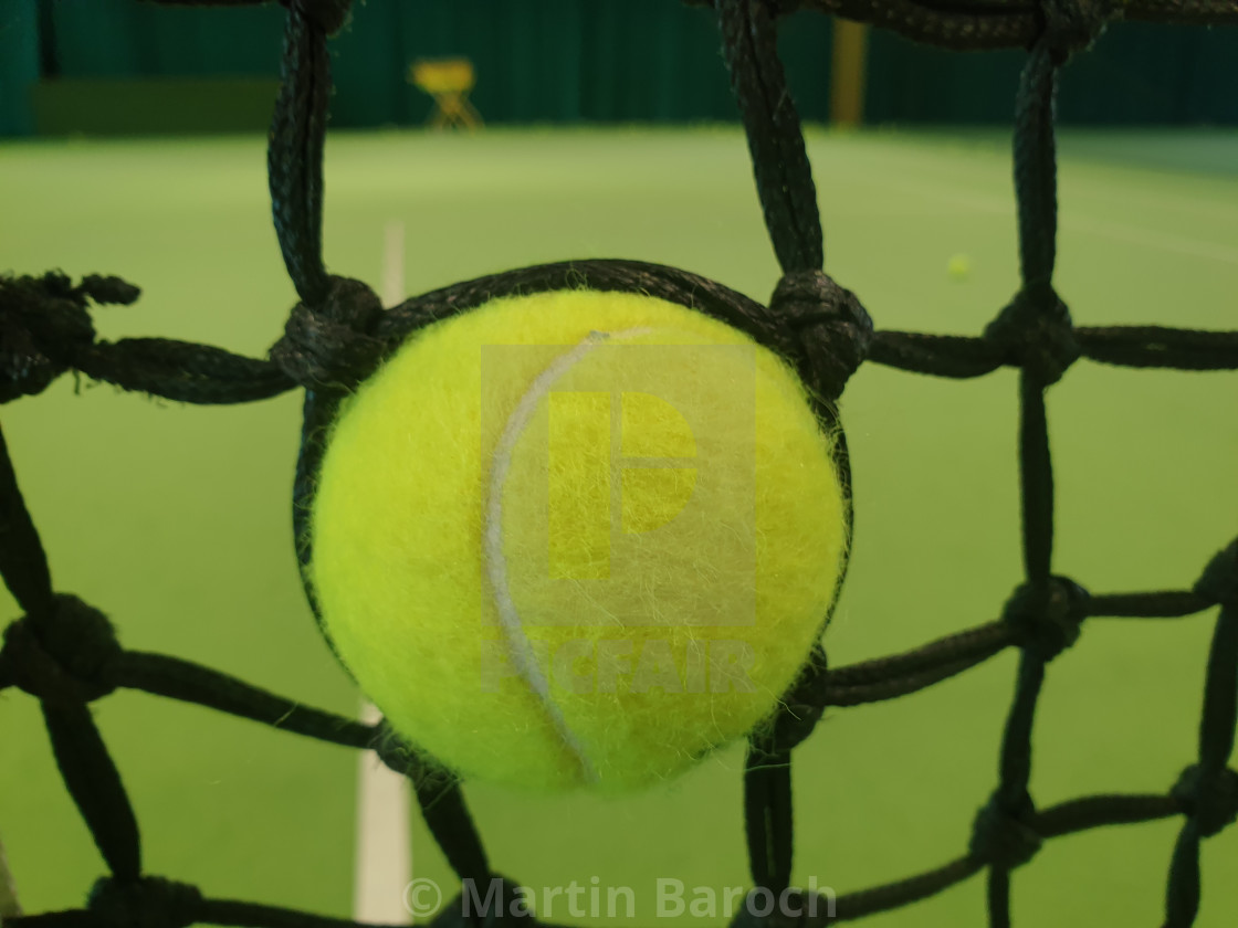 "Tennis Ball in the Net" stock image