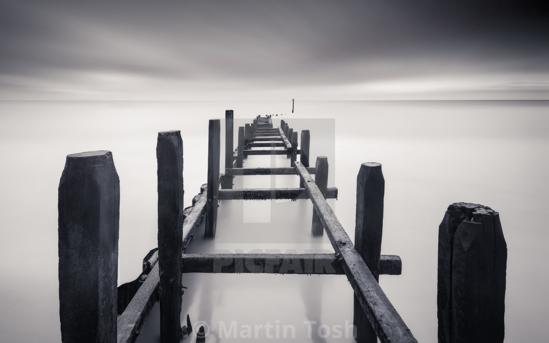 "Old wooden sea defences mono ii long exposure." stock image