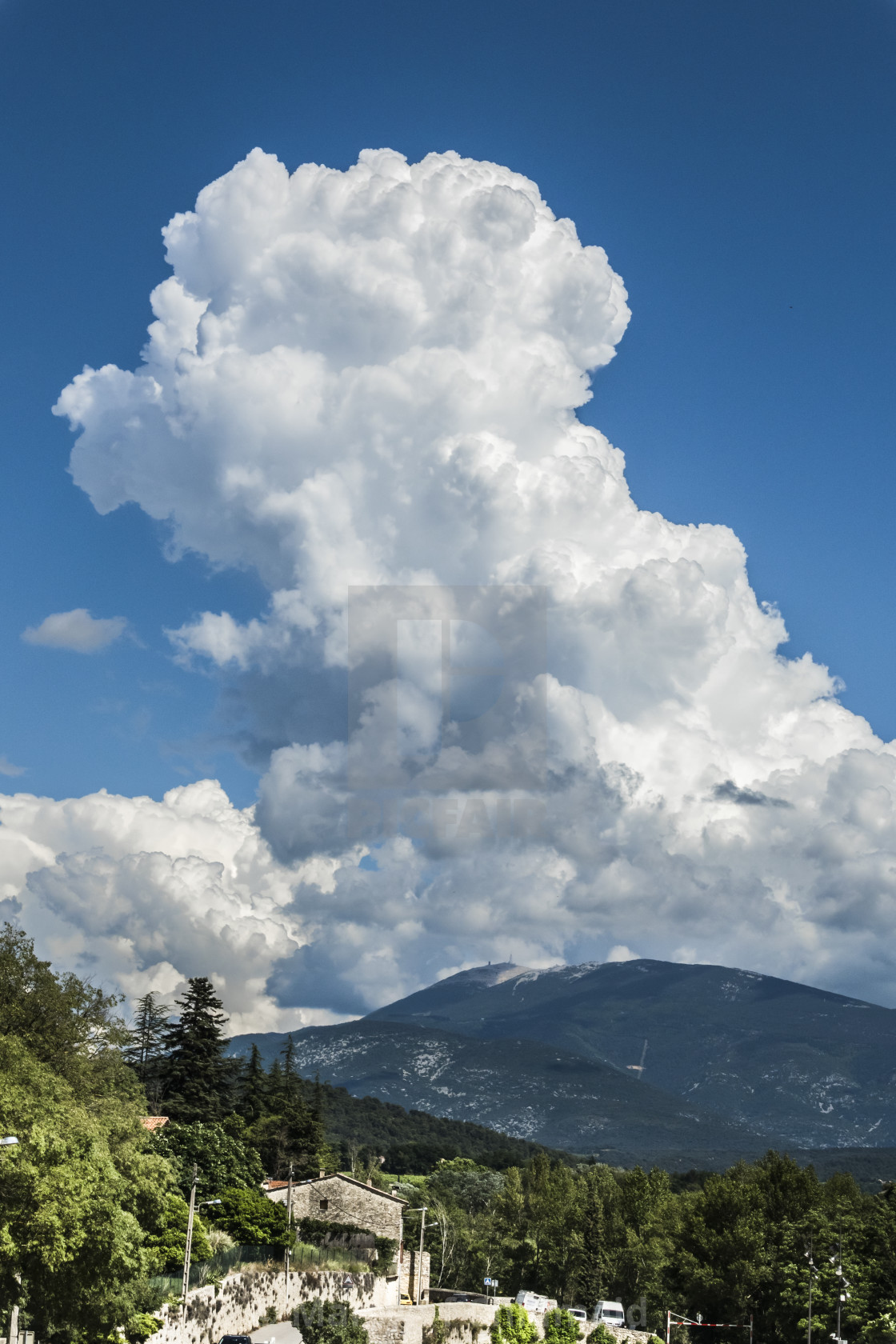 "Towering Cumulus congestus clouds over Mont Ventoux in Provence," stock image