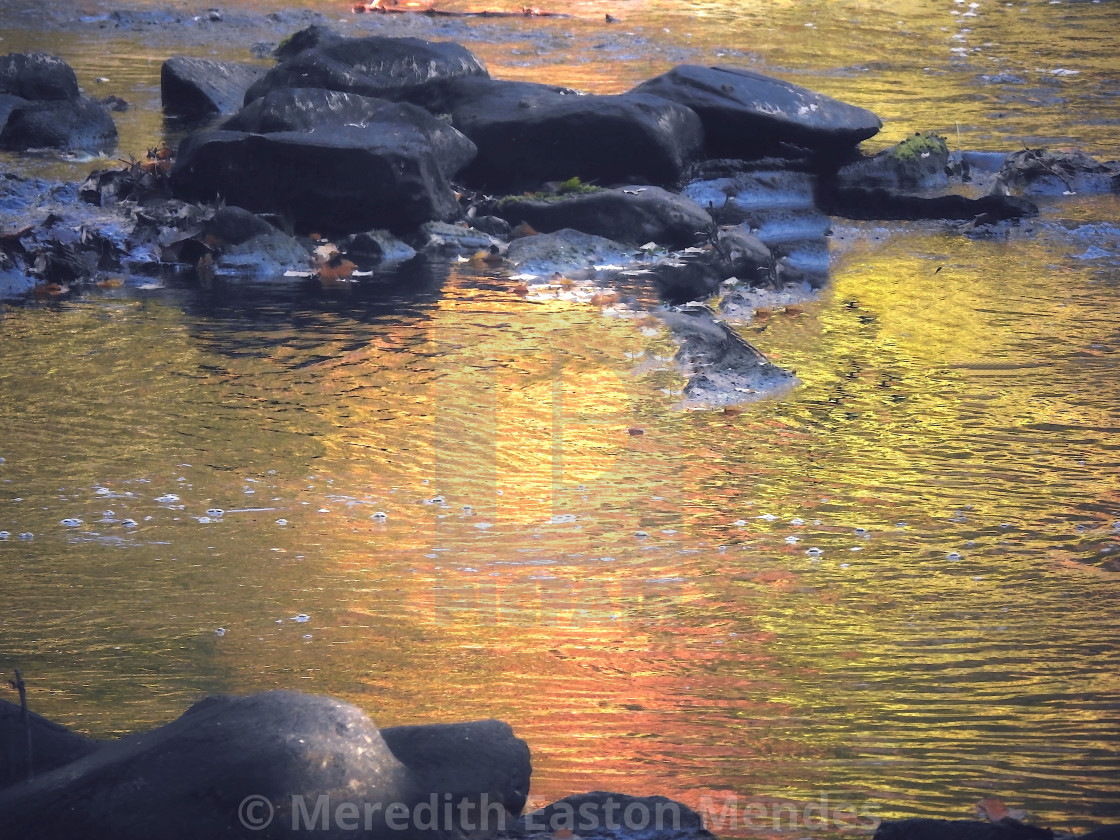 "Island of Rocks in an Orange River" by Meredith Easton Mendes - £10.00 "Island of Rocks in an Orange River" stock image