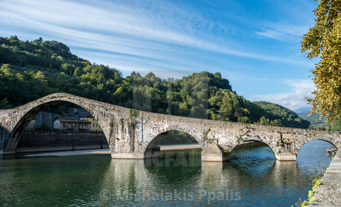 "The Devils bridge or Ponte della Maddalena above Serchio river. Bongo a Mozzani town in Tuscany, Italy" stock image