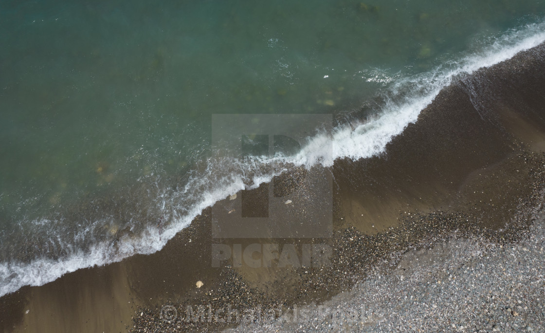 "Aerial view of ocean waves braking on a sandy beach. Nature background" stock image