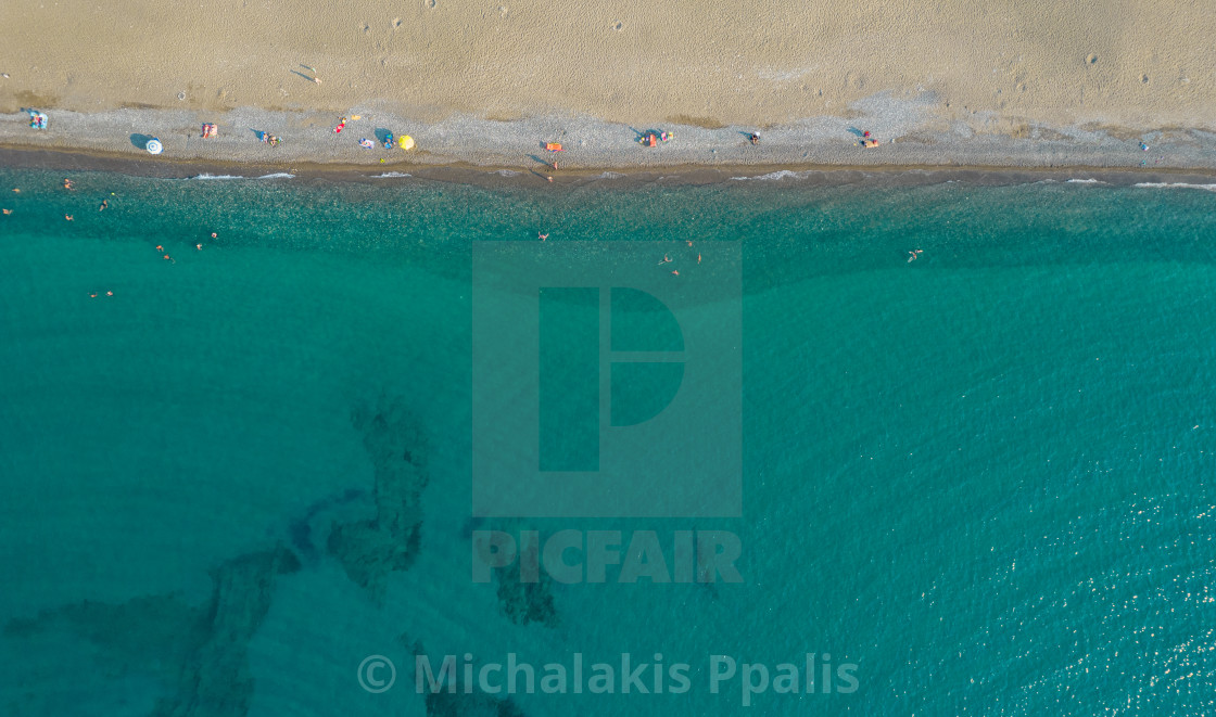 "Aerial view from flying drone of people relaxing on the beach. Paphos Cyprus" stock image