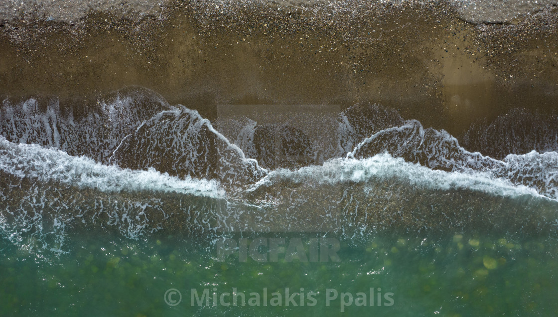 "Aerial view ocean waves braking on a sandy beach. Nature background" stock image