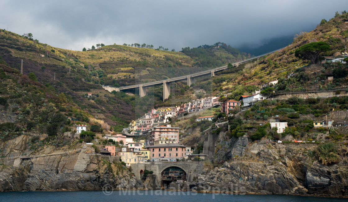 "City of Riomaggiore at the edge of a rocky cliff, Cinque Terre Liguria, Italy" stock image