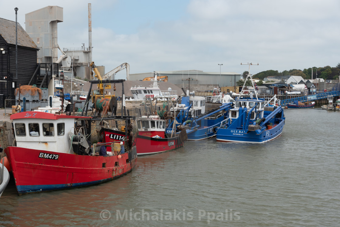 "Fishing boats moored at Whitstable harbor in Kent England" stock image