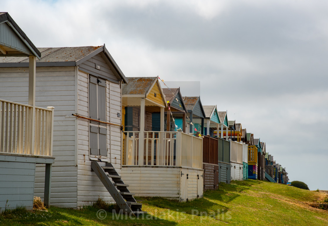 "Colorful holiday beach huts. Vacations coastal wooden houses" stock image