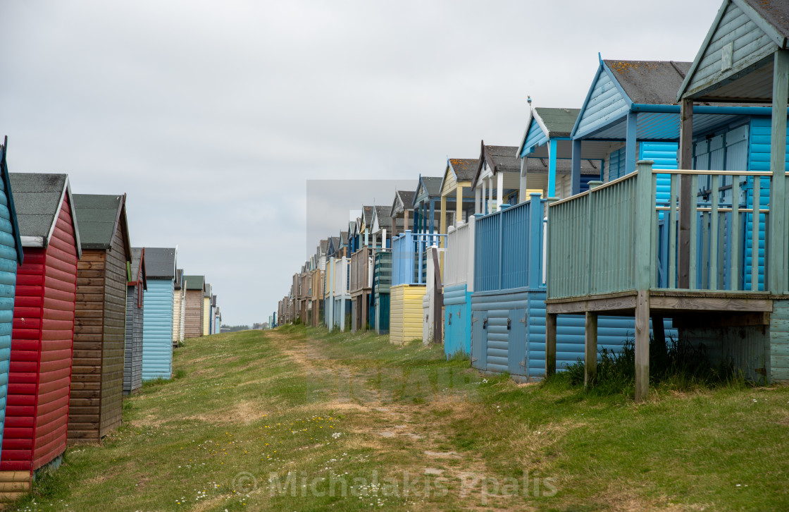 "Colorful holiday beach huts. Vacations coastal wooden houses" stock image